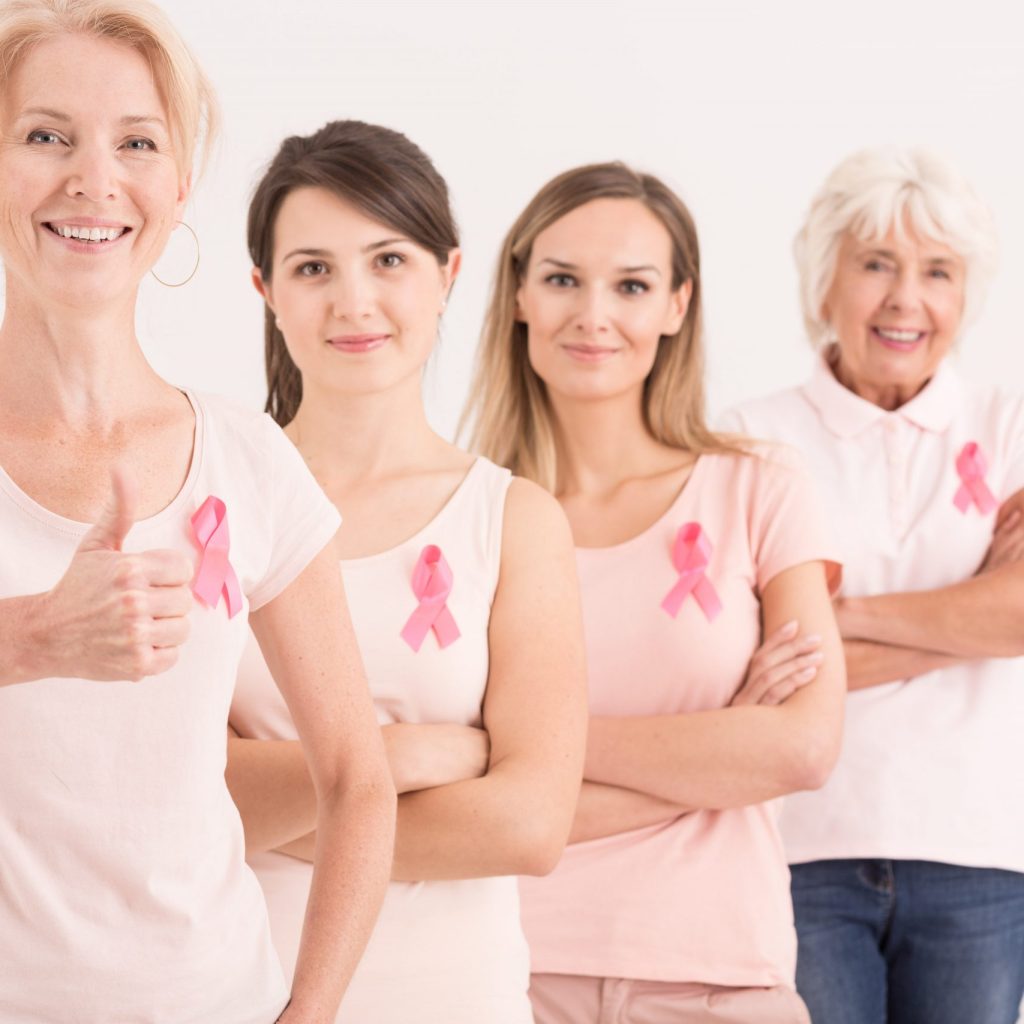 Multigenerational women with pink ribbons in breast cancer foundation